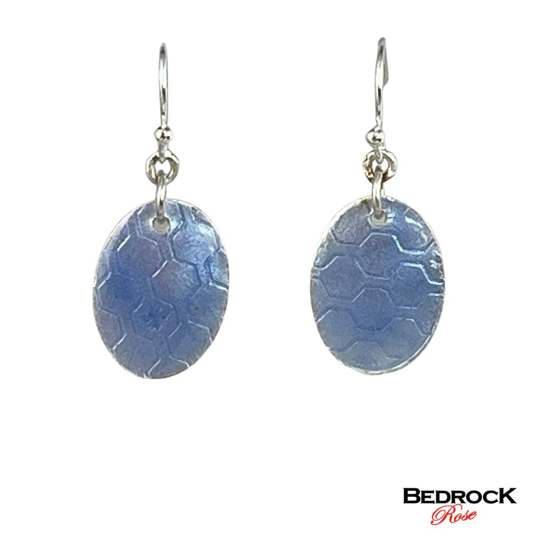 Periwinkle earrings, oval-shaped jewelry, fashion accessories, elegant fashion jewelry, handcrafted earrings, timeless fashion pieces, eye-catching jewelry designs