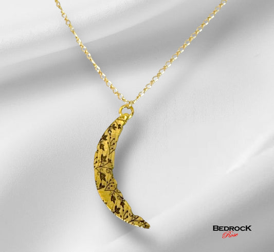 Bedrock Rose gold crescent pendant necklace with intricate vine pattern and gold fill chain.