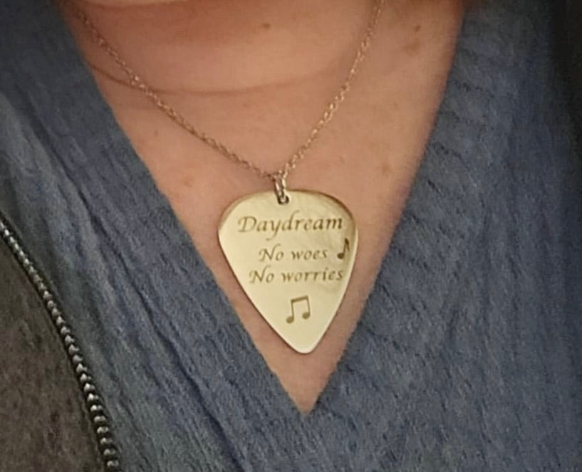 Personalized guitar pick pendant on model