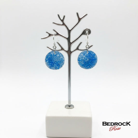 Bedrock Rose circular dangle earrings featuring roll-printed grape and leaf motifs in cobalt blue vitreous enamel.