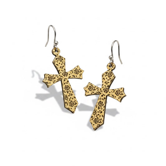 Bedrock Rose gold cross dangle earrings featuring intricate laser-etched floral rose patterns on a textured surface.