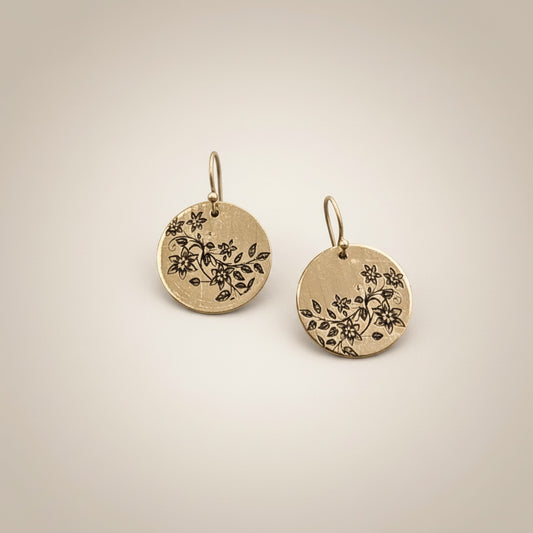 Bedrock Rose gold disc earrings with engraved floral vines. High-polish brass dangles.