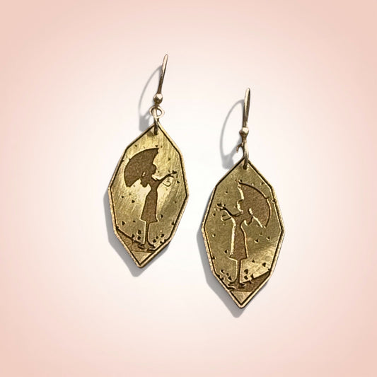 Bedrock Rose gold-plated drop earrings featuring a silhouette of a girl with an umbrella.