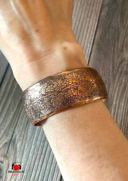 Bedrock Rose Grapevine Copper Cuff featuring an ornate, polished grapevine pattern on a convex-formed band.