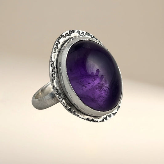 Bedrock Rose oval amethyst statement ring in sterling silver with a textured bezel and band. Size 8.