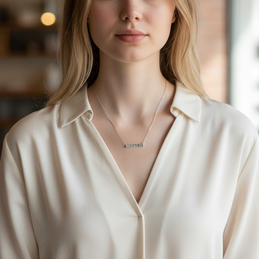 Bedrock Rose silver vote necklace with laser-cut sterling silver pendant and hypoallergenic stainless steel chain.
