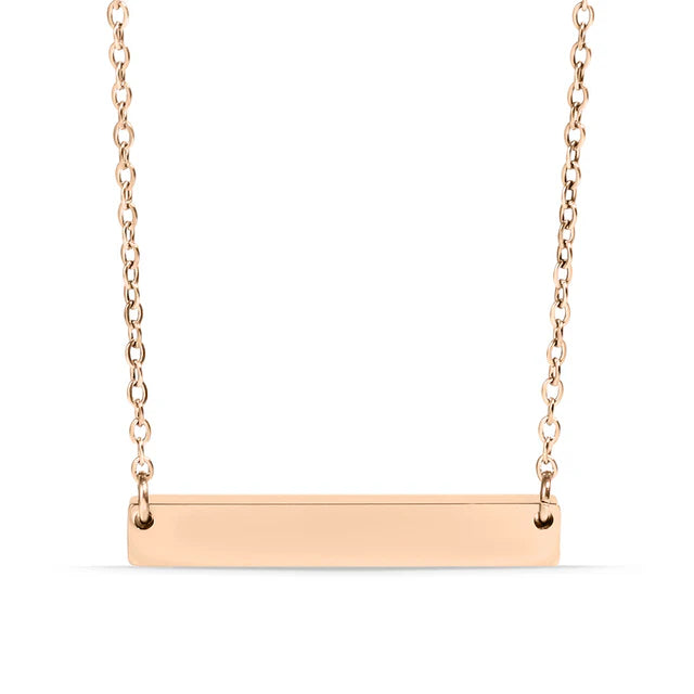 Rose gold bar necklace on a white background