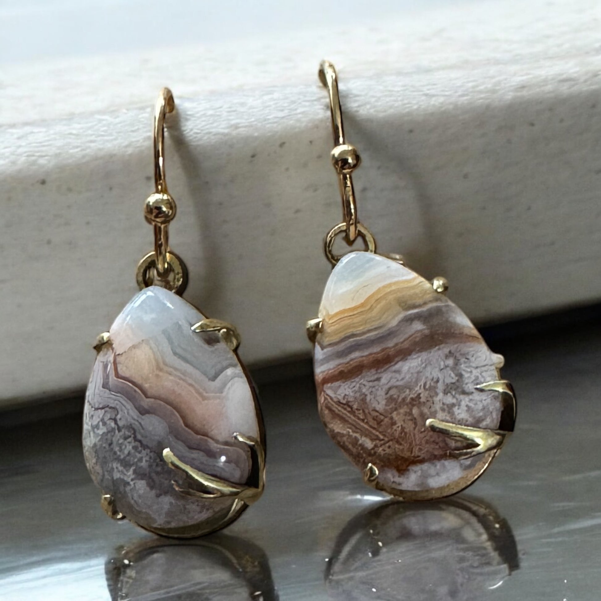 Pear-Shape, prong set crazy lace agate dangling earrings, high-polished brass