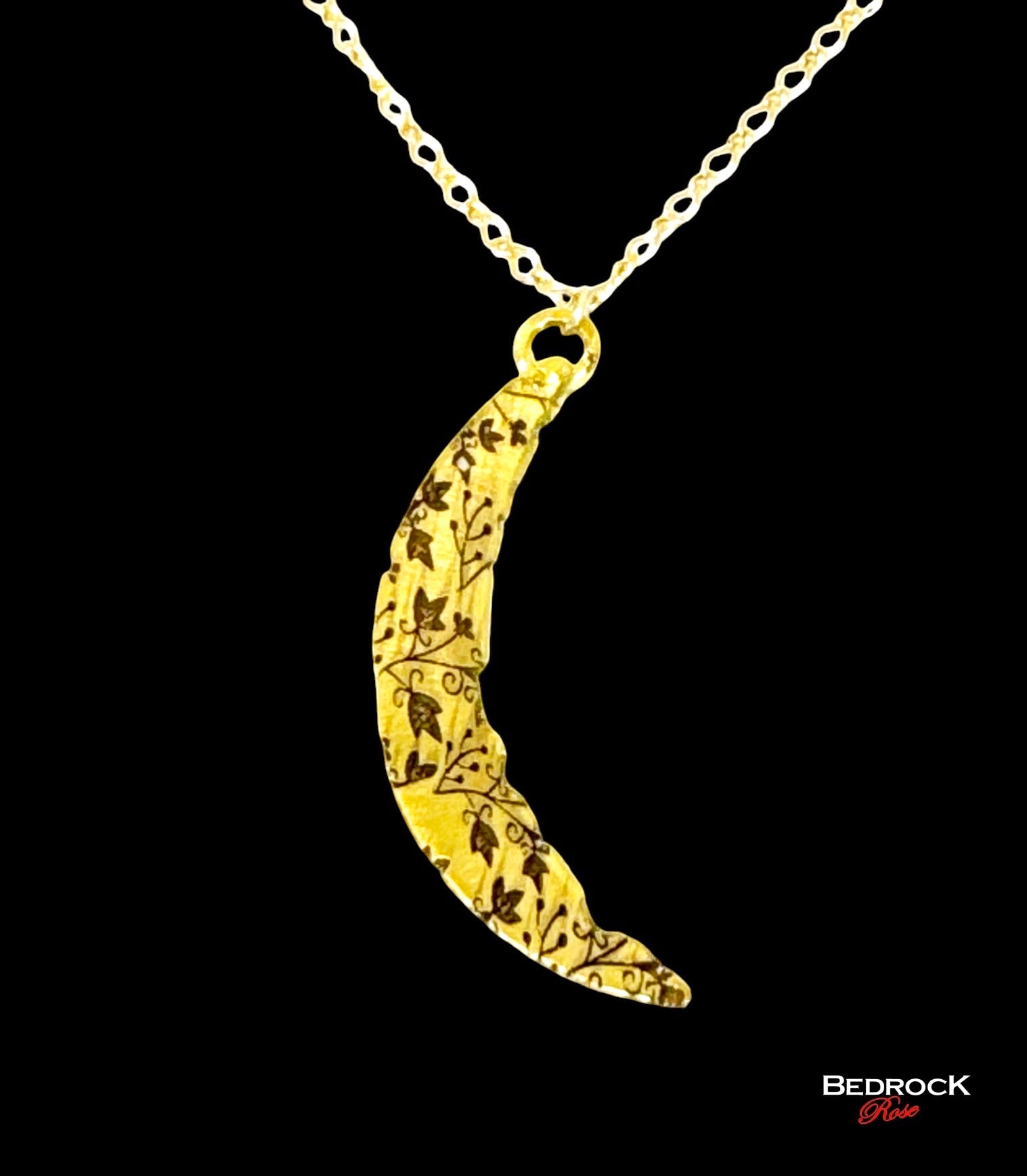 Bedrock Rose gold crescent pendant necklace with intricate vine pattern and gold fill chain.