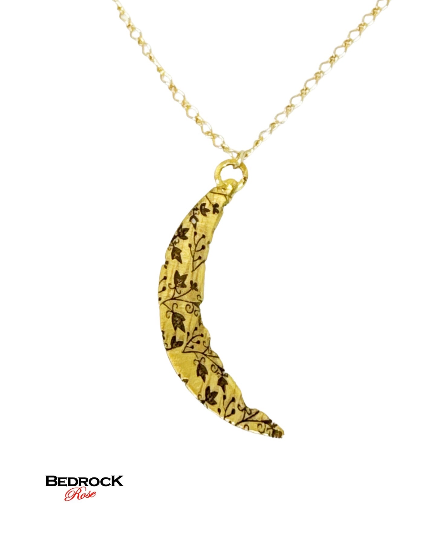 Bedrock Rose gold crescent pendant necklace with intricate vine pattern and gold fill chain.