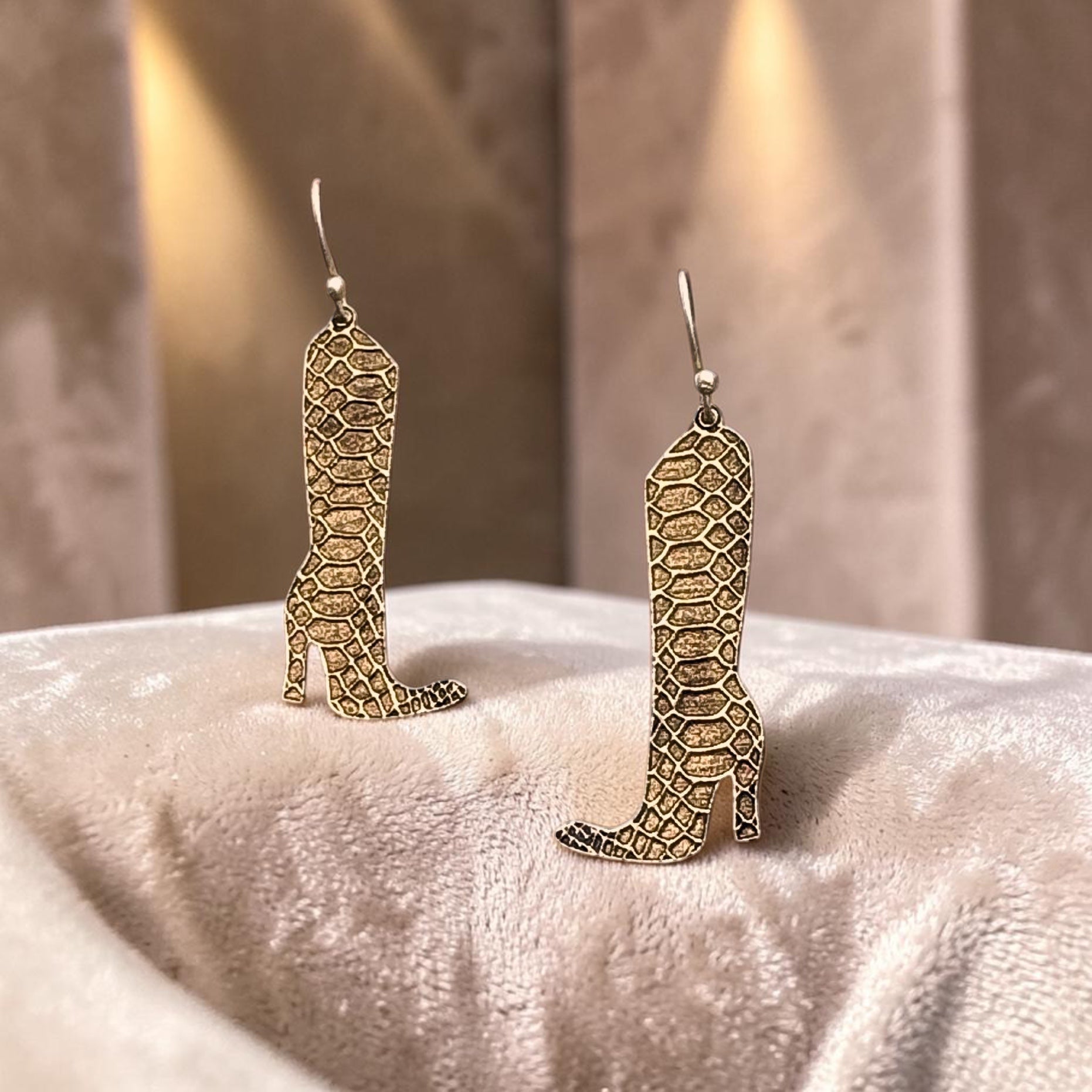 Bedrock Rose gold snakeskin boot dangling earrings made of laser cut brass with 24k gold plating on steel ear wires.