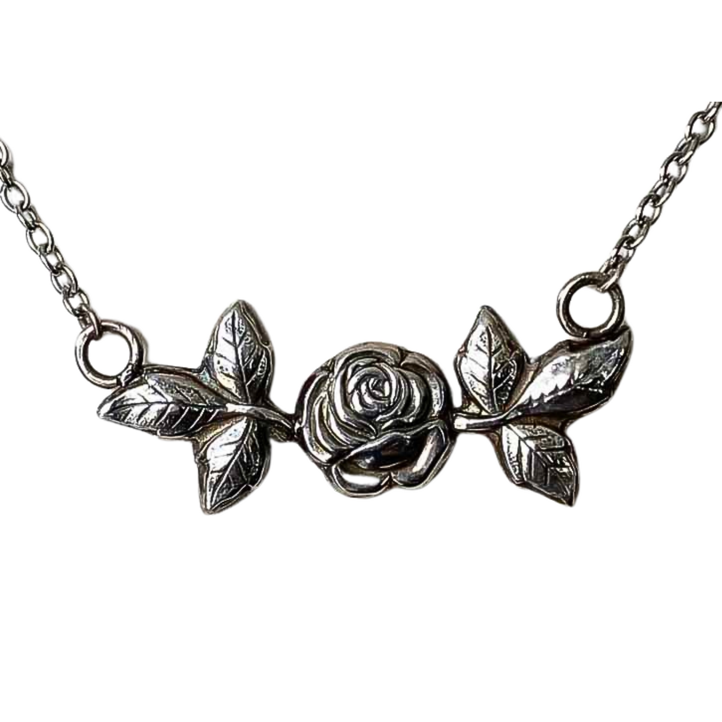 Fine Silver Rose Pendant with Leaves suspended from a chain close up, hybrid tea rose necklace, gift for her