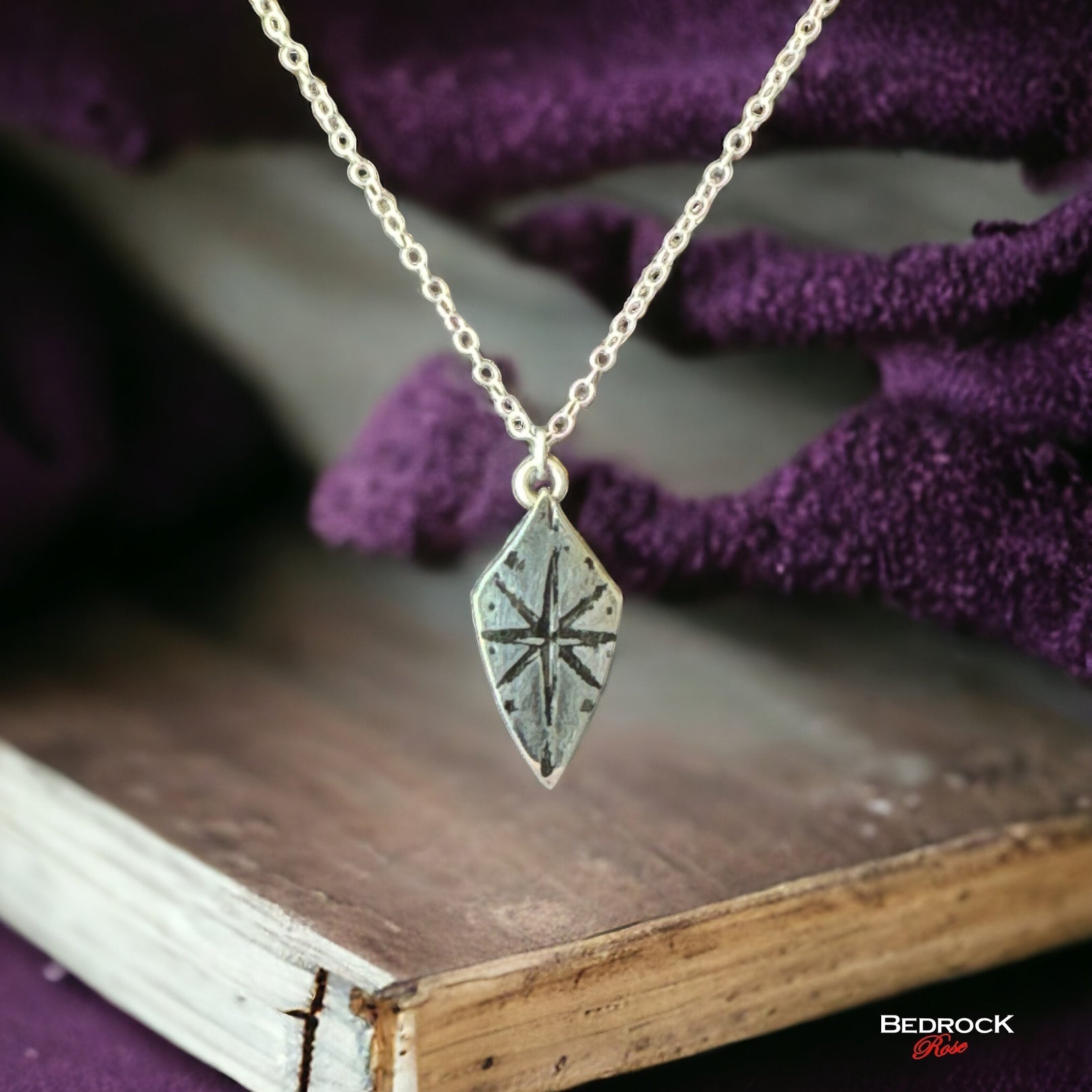 Bedrock Rose silver compass rose shield pendant necklace with a 16" sterling silver cable chain.