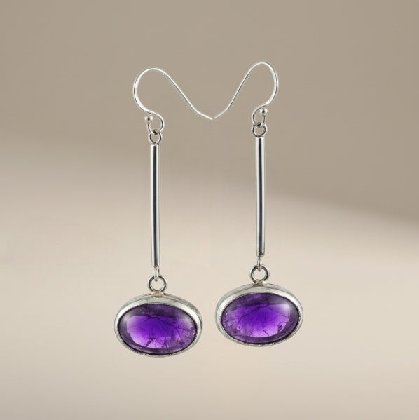 Bedrock Rose oval amethyst drop earrings in sterling silver with an open-back bezel setting and bar dangles.