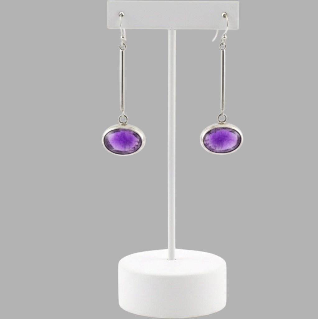 Bedrock Rose oval amethyst drop earrings with open-back sterling silver settings and polished bar dangles.
