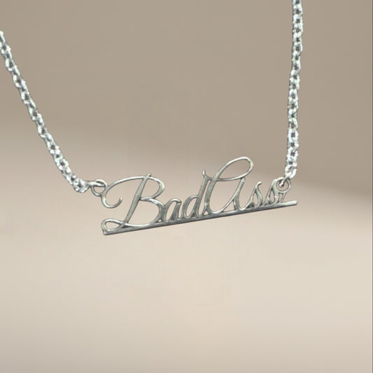 Bedrock Rose sterling silver Bad Ass script pendant necklace on a sleek stainless steel chain.