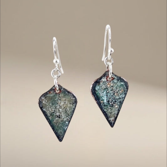 Bedrock Rose black and sparkle-effect arabesque dangling earrings with translucent enameled glass on copper and surgical steel ear wires.
