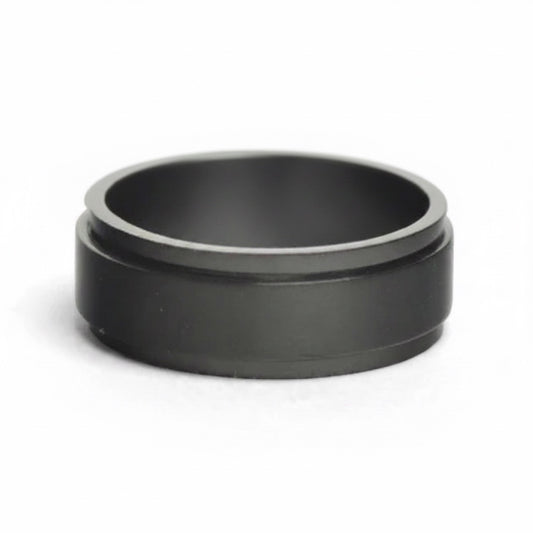 Bedrock Rose black stainless steel spinner ring with a matte finish, designed for anxiety relief and custom engraving.