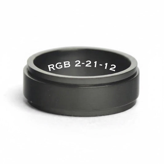 Bedrock Rose personalized black stainless steel spinner ring with custom white engraved text on the inner band.