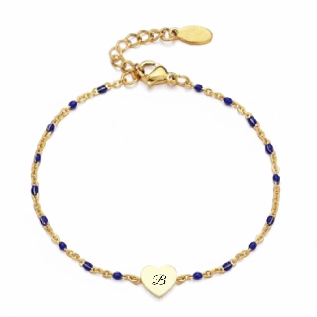 Bedrock Rose gold cable chain bracelet with blue beads and a central heart charm featuring a letter B engraving.
