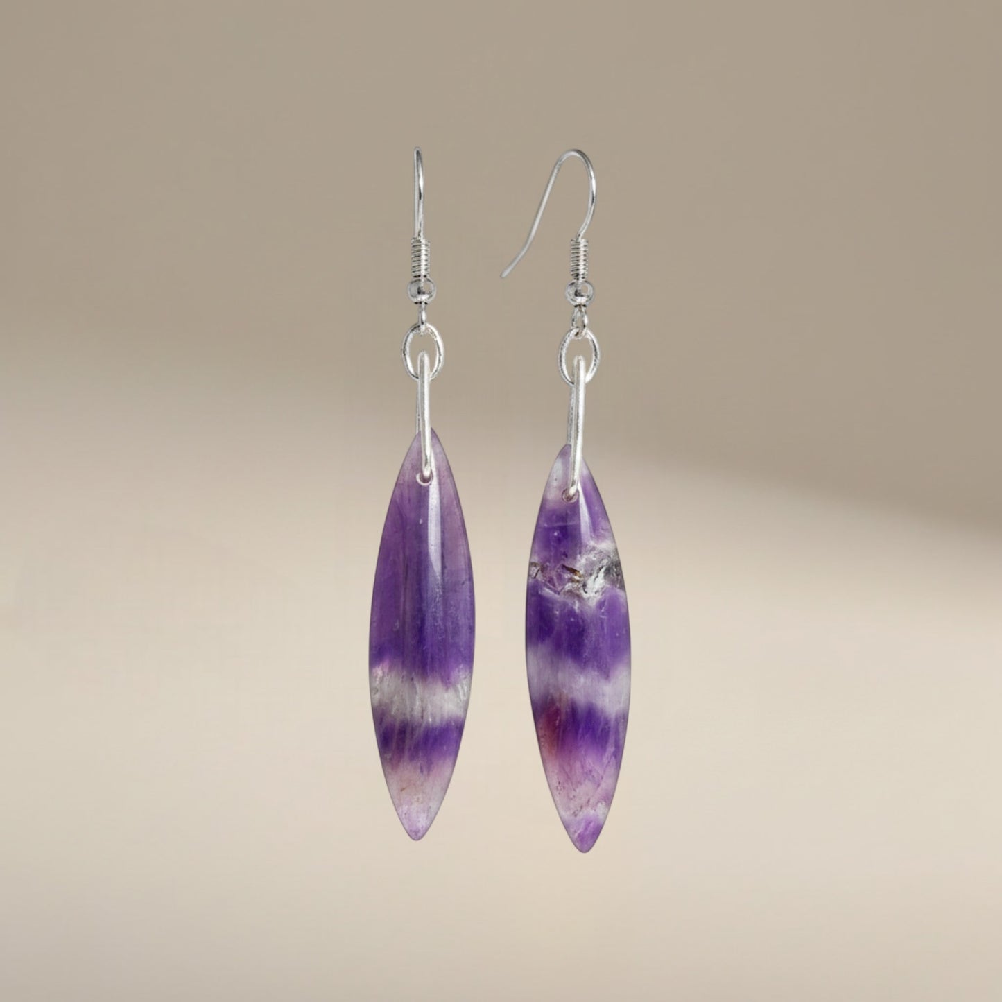 Bedrock Rose Chevron Amethyst Dangling Earrings, marquise-shaped natural amethyst stones with purple and white bands, silver-tone hooks.