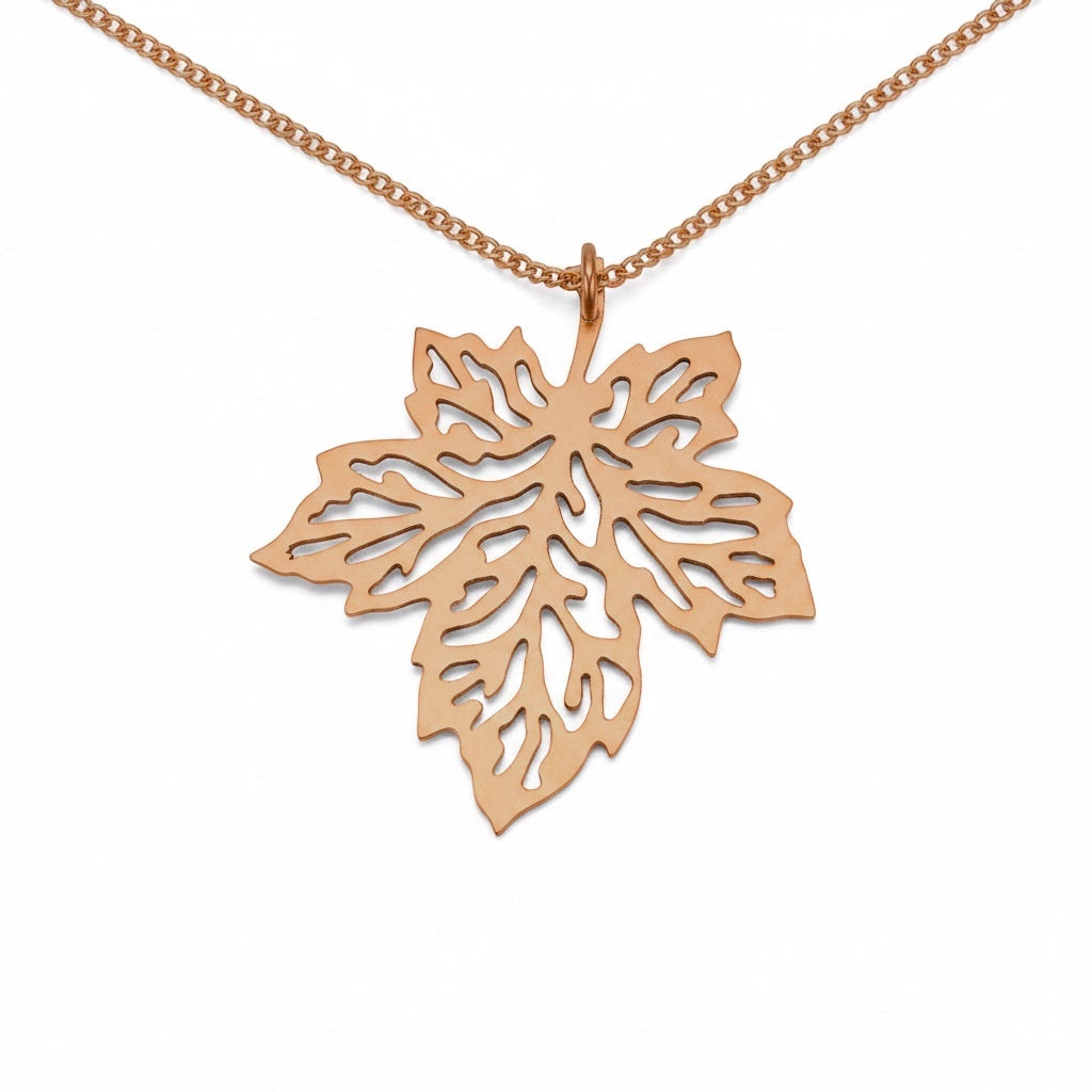 Bedrock Rose hand-pierced copper maple leaf pendant necklace with intricate detailing on an 18" copper chain.