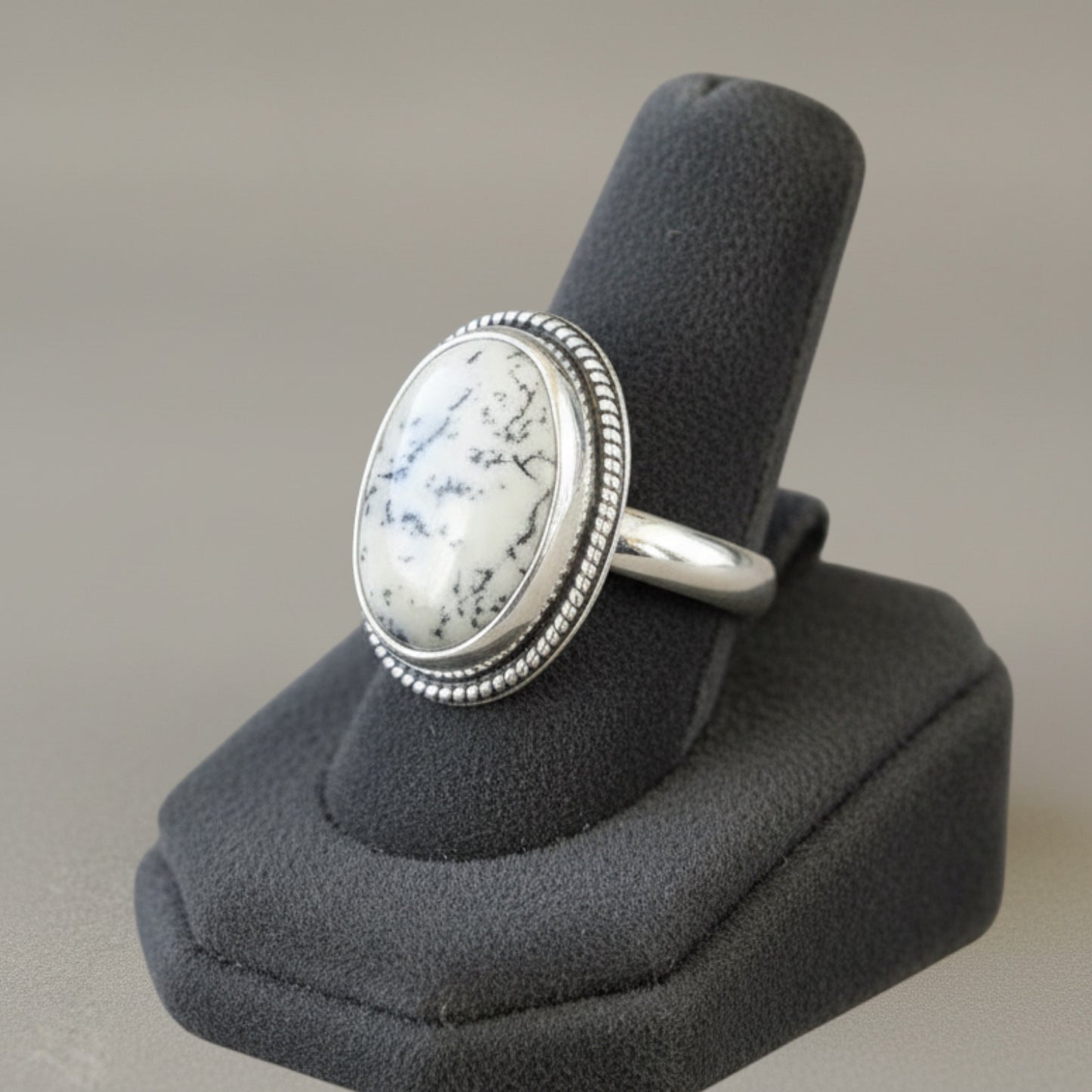Bedrock Rose dendritic opal Merlinite statement ring in sterling silver with a decorative twisted wire frame.