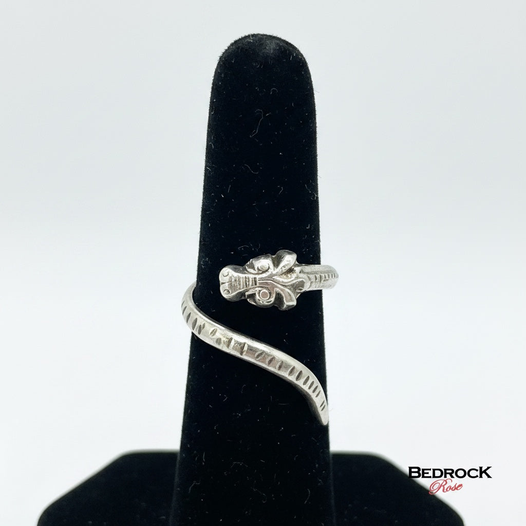 Bedrock Rose sterling silver adjustable dragon wrap ring with textured scaled tail and oxidized patina.