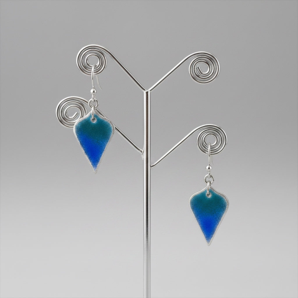Bedrock Rose Seahawks shield dangle earrings in fine silver with a gradient of navy blue and action green enamel.
