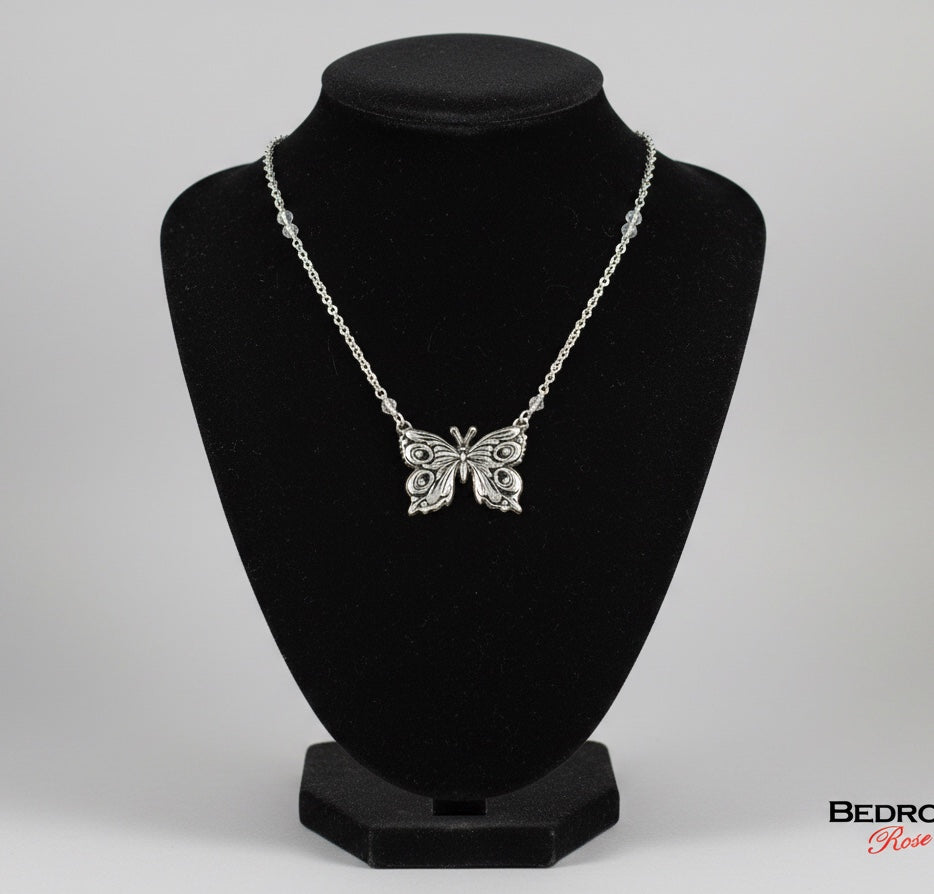 Bedrock Rose fine silver butterfly pendant on a delicate stainless steel cable chain displayed on a black bust