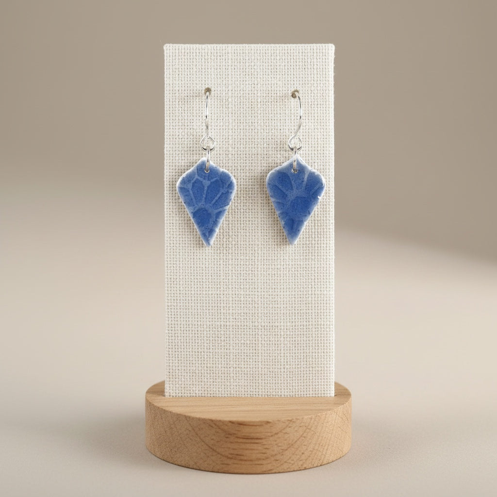 Bedrock Rose frosted sky blue floral dangle earrings featuring embossed fine silver and vitreous enamel on steel wires