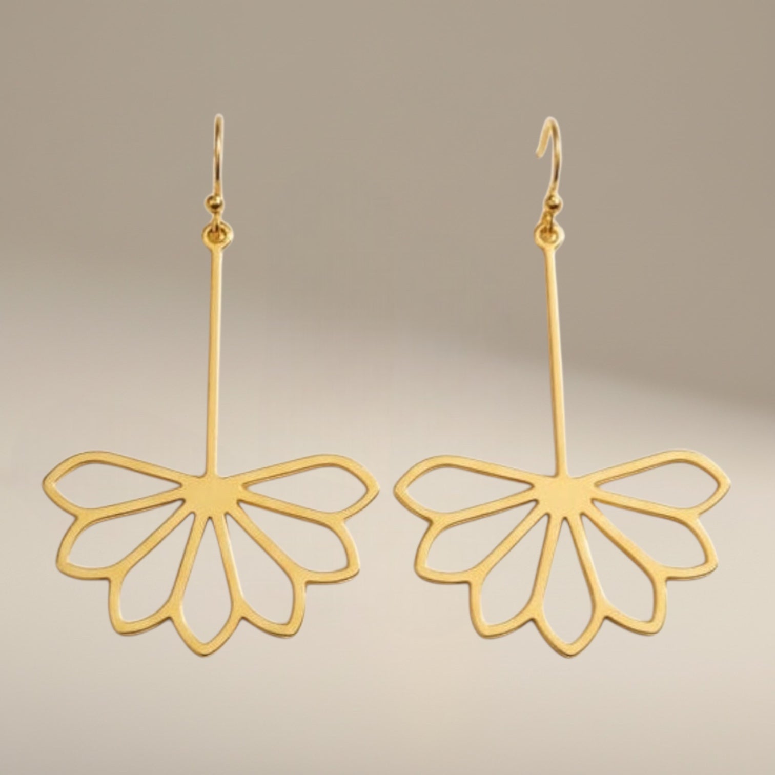 Bedrock Rose gold-plated brass drop earrings featuring a laser-cut Art Deco flower design with geometric petals.