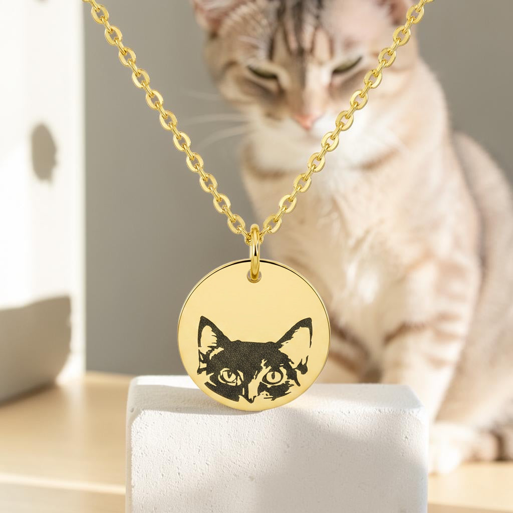 Bedrock Rose gold stainless steel necklace featuring a laser-engraved cat face on a round pendant with a cable chain.