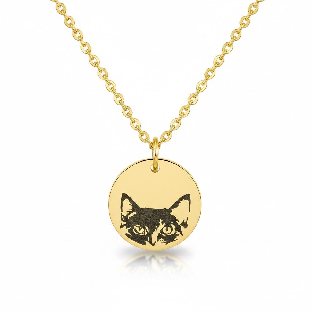 Bedrock Rose gold stainless steel necklace featuring a laser-engraved cat face on a round disc pendant.