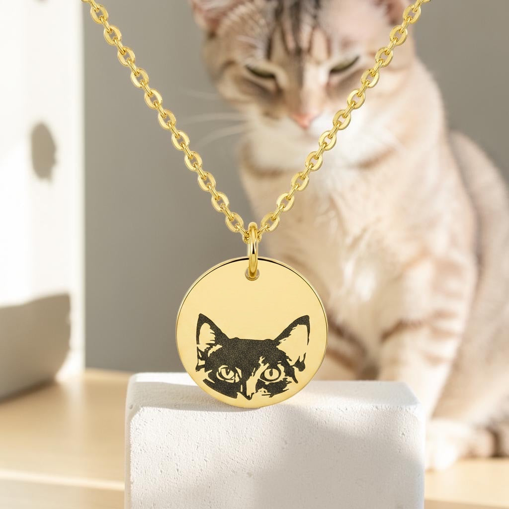 Bedrock Rose gold stainless steel necklace featuring a laser-engraved cat face on a round pendant with a cable chain.