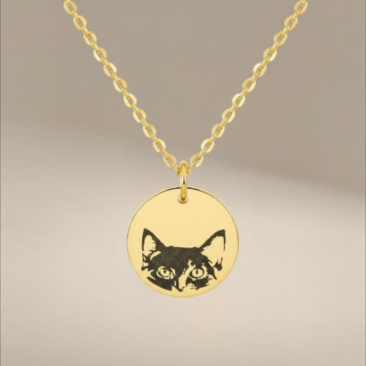 Bedrock Rose gold stainless steel necklace featuring a laser-engraved cat face on a round pendant with a cable chain.