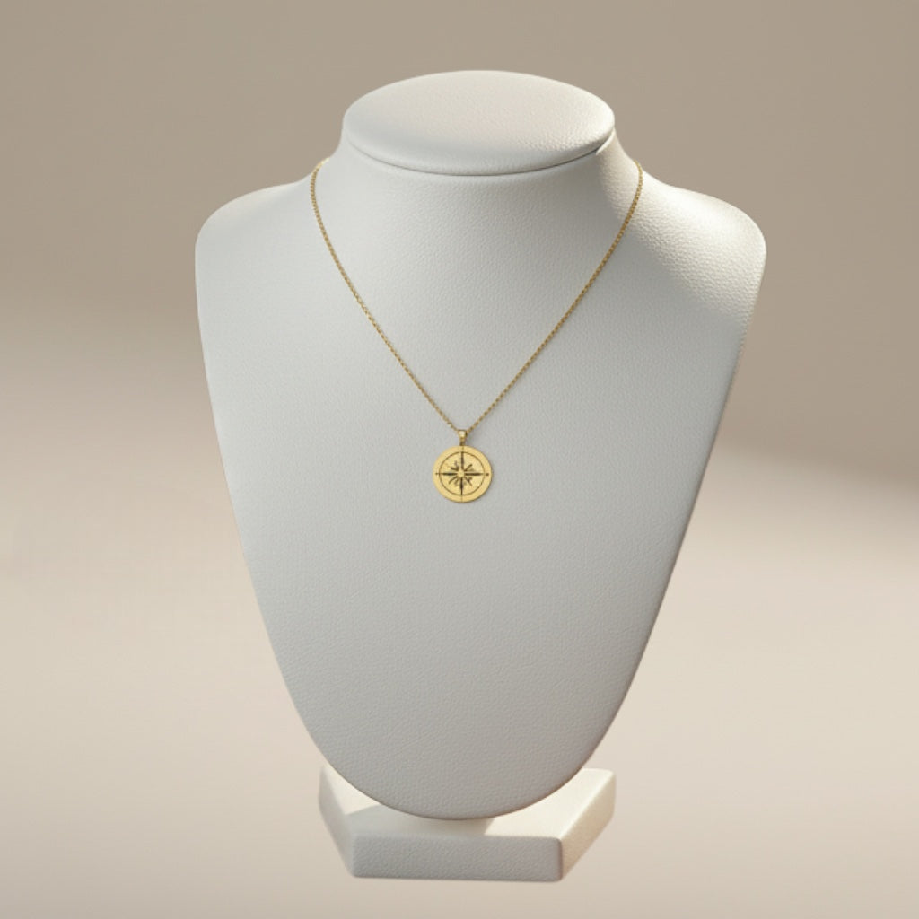 Bedrock Rose gold compass rose necklace on faceted chain, symbolizing purpose and self-discovery.
