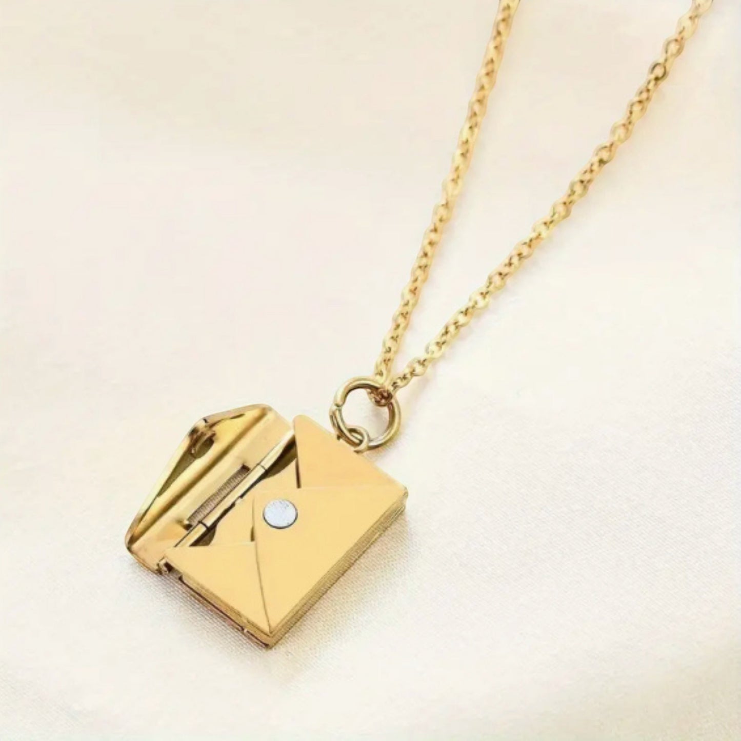 Bedrock Rose gold envelope pendant necklace with a hidden message compartment on a delicate cable chain.