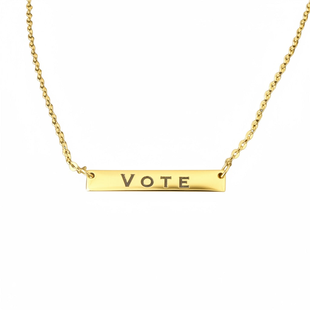 Bedrock Rose gold-plated stainless steel bar necklace with the word VOTE engraved. Features a delicate chain with an extender.