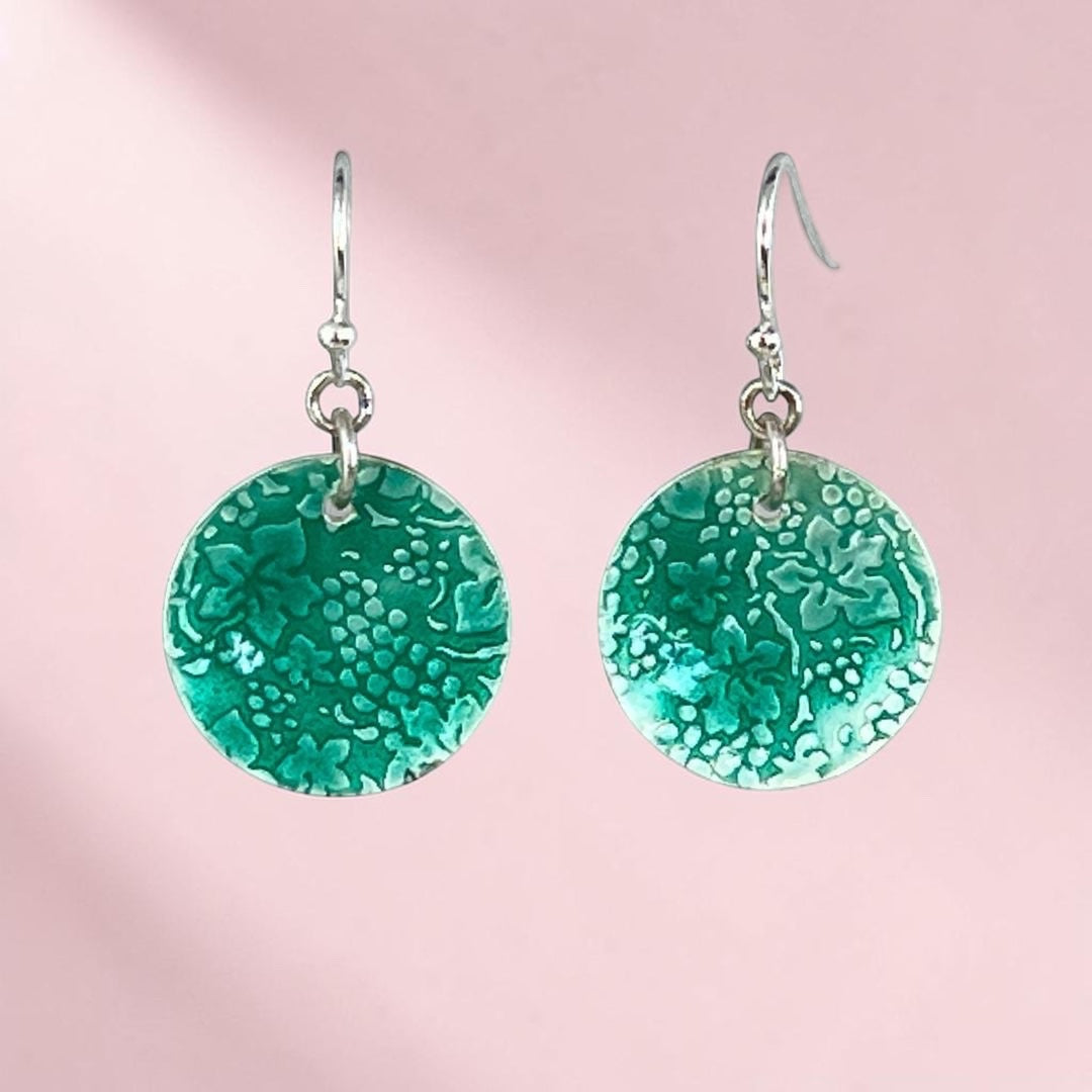 Bedrock Rose Vineyard Harvest dangle earrings featuring circular fine silver discs with transparent green enamel.