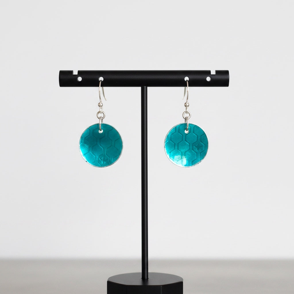 Bedrock Rose honeycomb dangle earrings in fine silver with forest green vitreous enamel and honeybee detail.