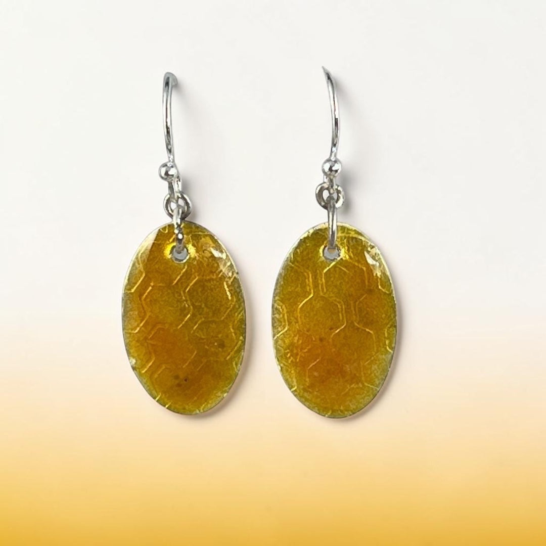 Bedrock Rose oval dangling earrings featuring a honey-colored honeycomb pattern in vitreous enamel on fine silver.
