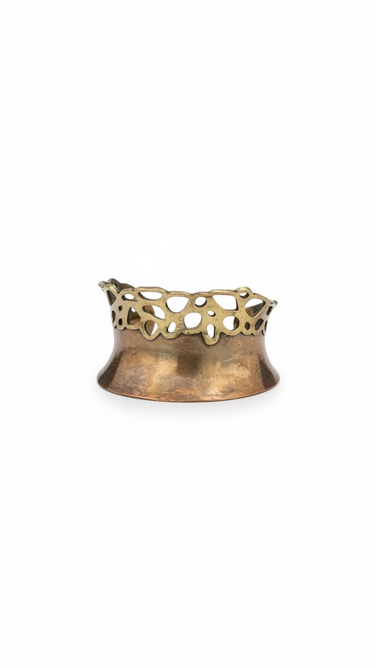 Bedrock Rose lacy pierced cuff bracelet featuring a polished copper base and an intricate brass filigree top edge.