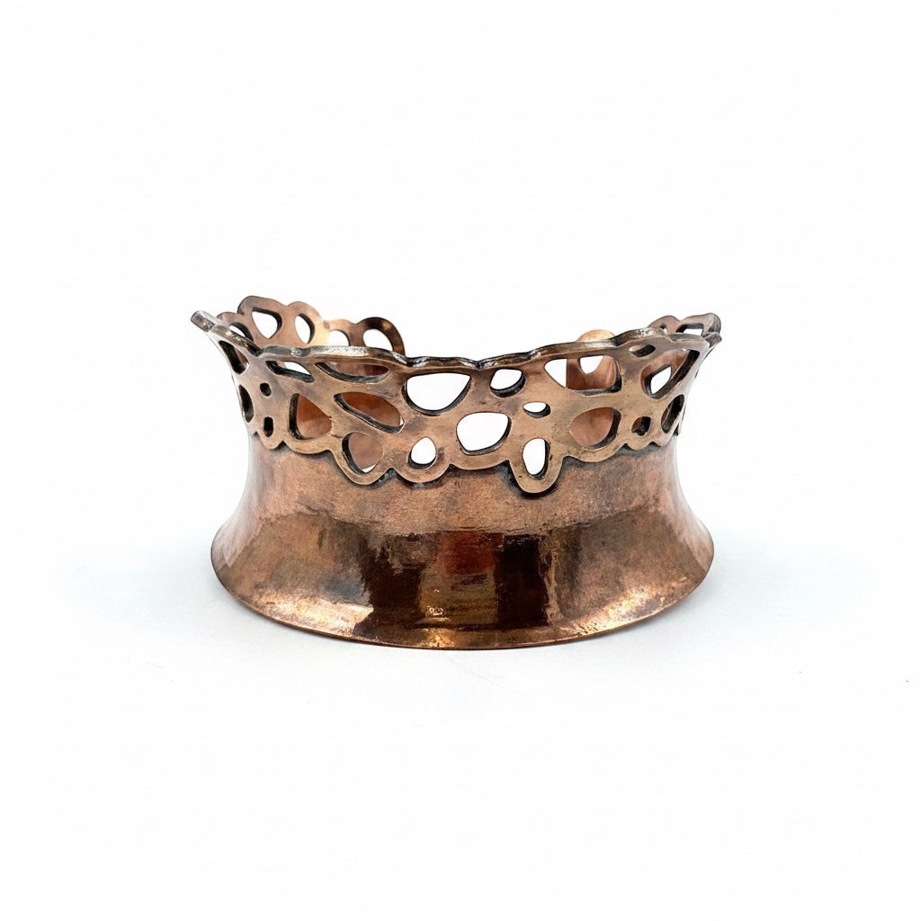Bedrock Rose lacy pierced copper cuff bracelet with a polished metallic finish and intricate cutout design