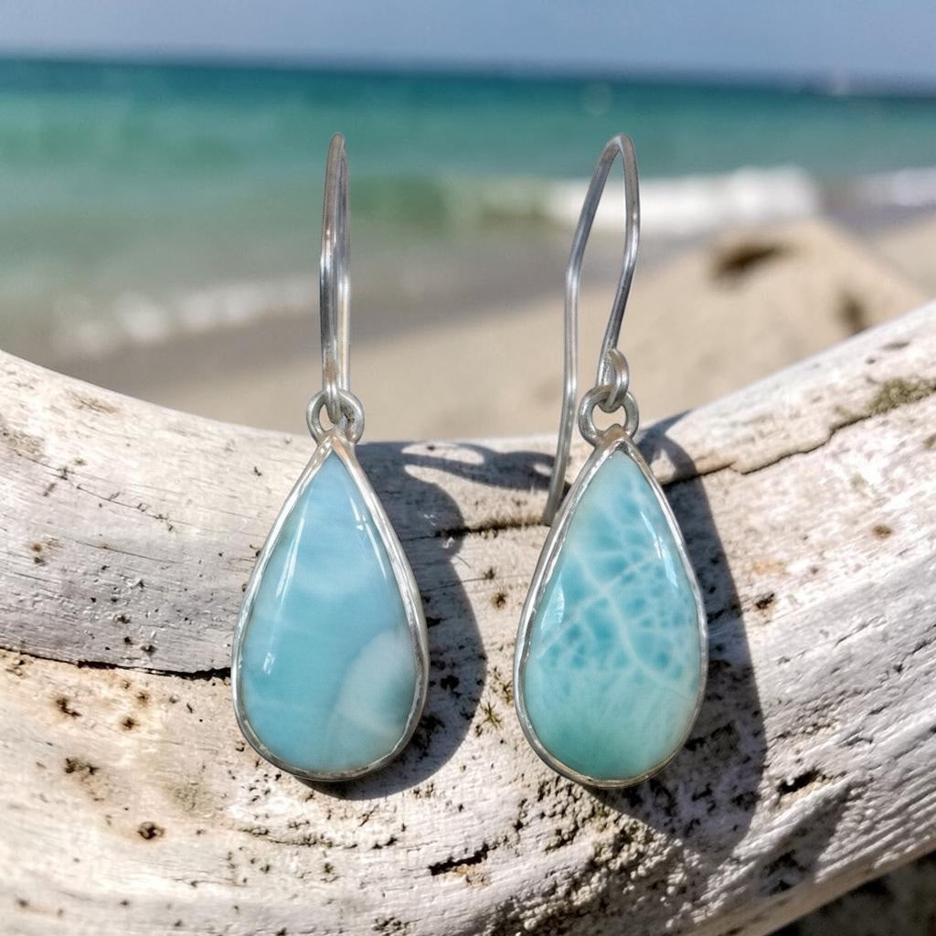 Bedrock Rose handcrafted sterling silver dangle earrings featuring natural blue Larimar teardrop cabochons.
