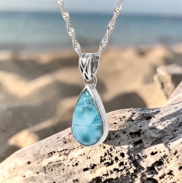 Bedrock Rose handcrafted teardrop larimar pendant in a sterling silver bezel setting on a stainless steel chain.