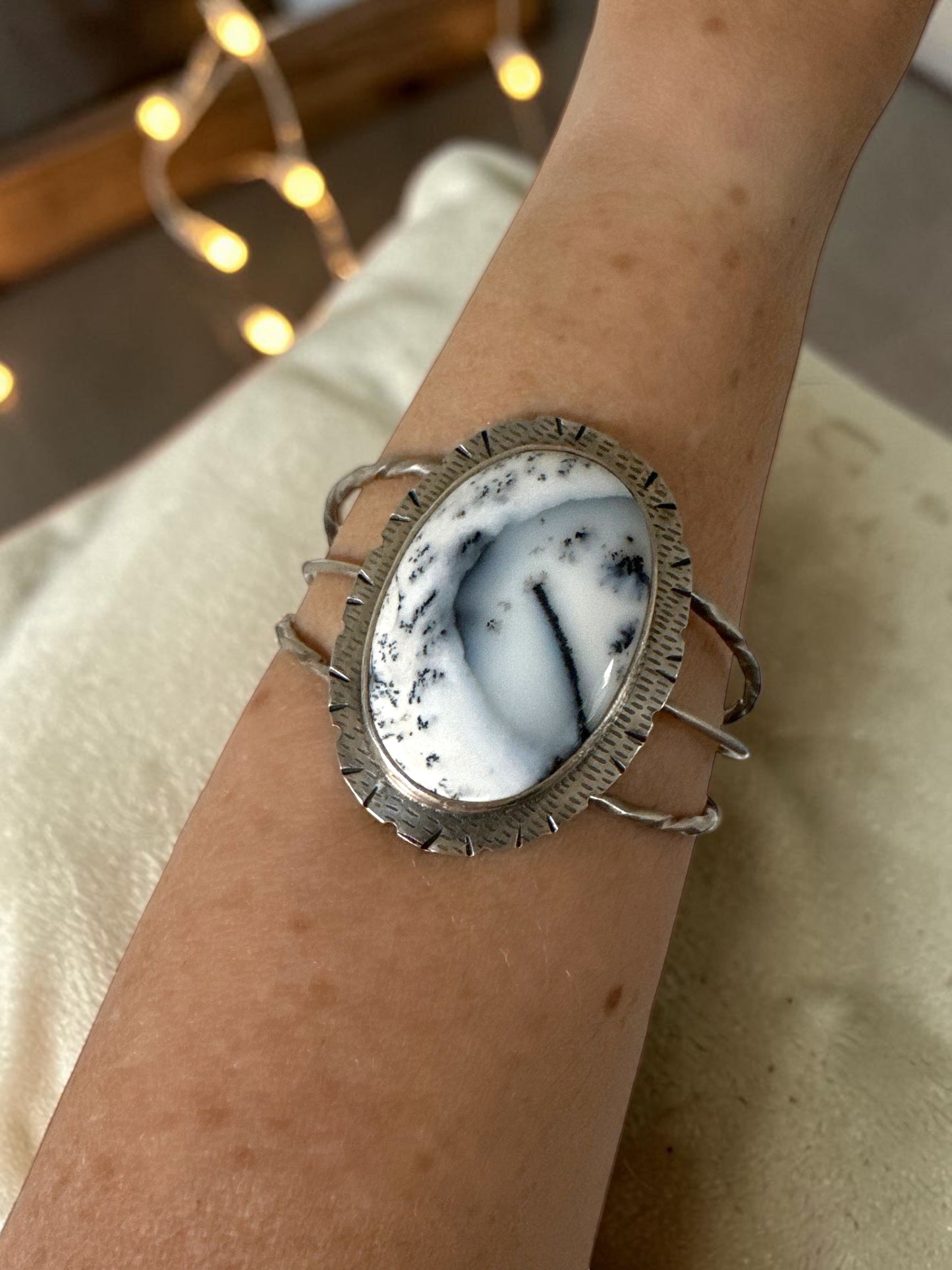Bedrock Rose statement cuff featuring an oval Merlinite dendritic agate stone set in textured sterling silver