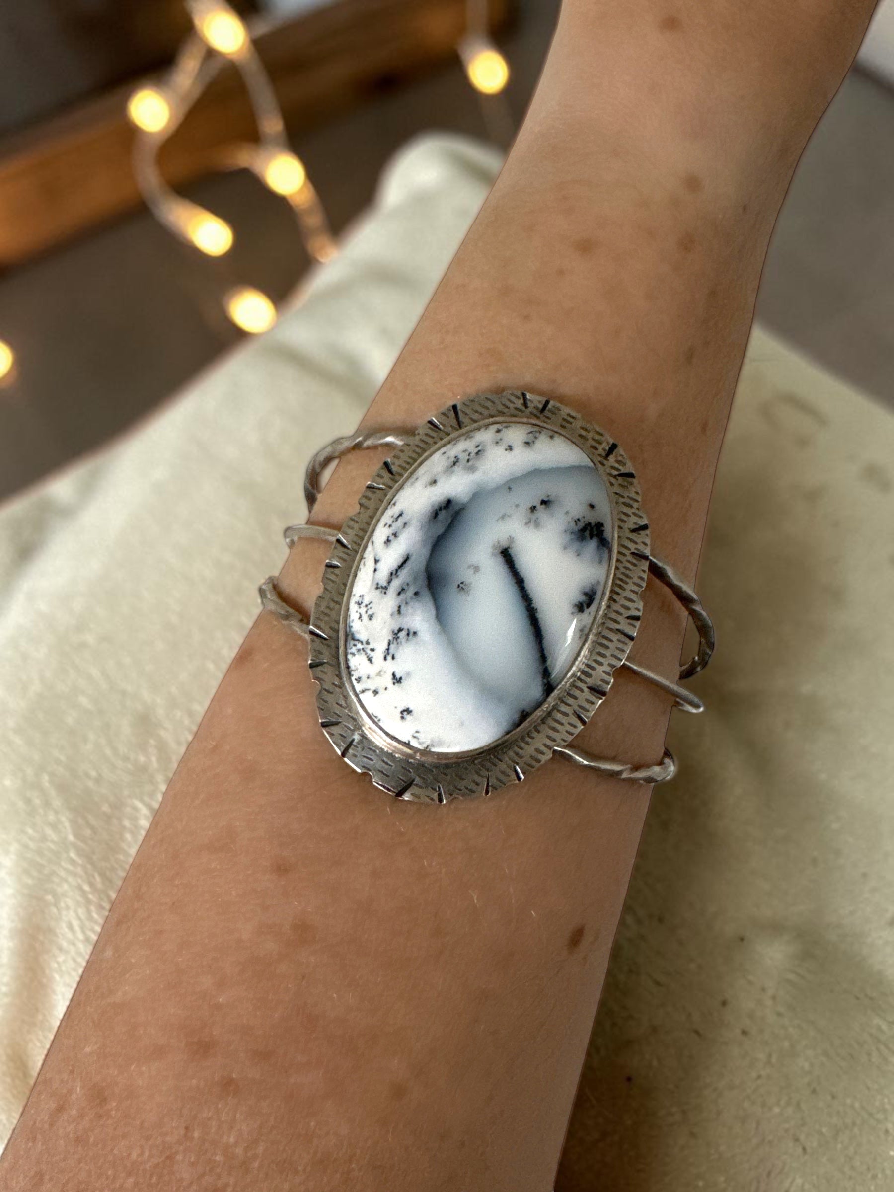 Bedrock Rose statement cuff featuring an oval Merlinite dendritic agate stone set in textured sterling silver