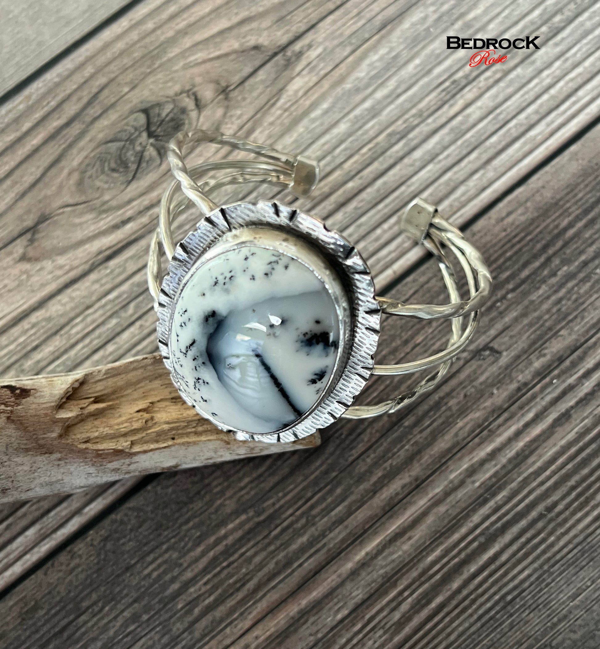 Bedrock Rose statement cuff featuring a large oval Merlinite stone set in textured sterling silver on a wire band.