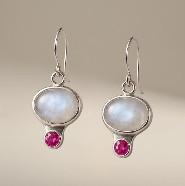 Bedrock Rose sterling silver dangling earrings with oval iridescent moonstone and round pink gemstone.